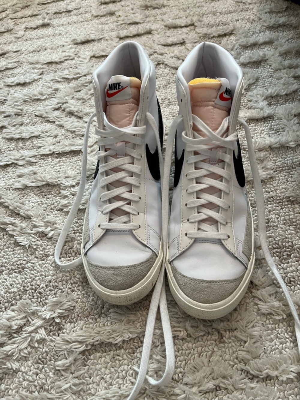 Nike White High-Top Sneakers with Black Swoosh